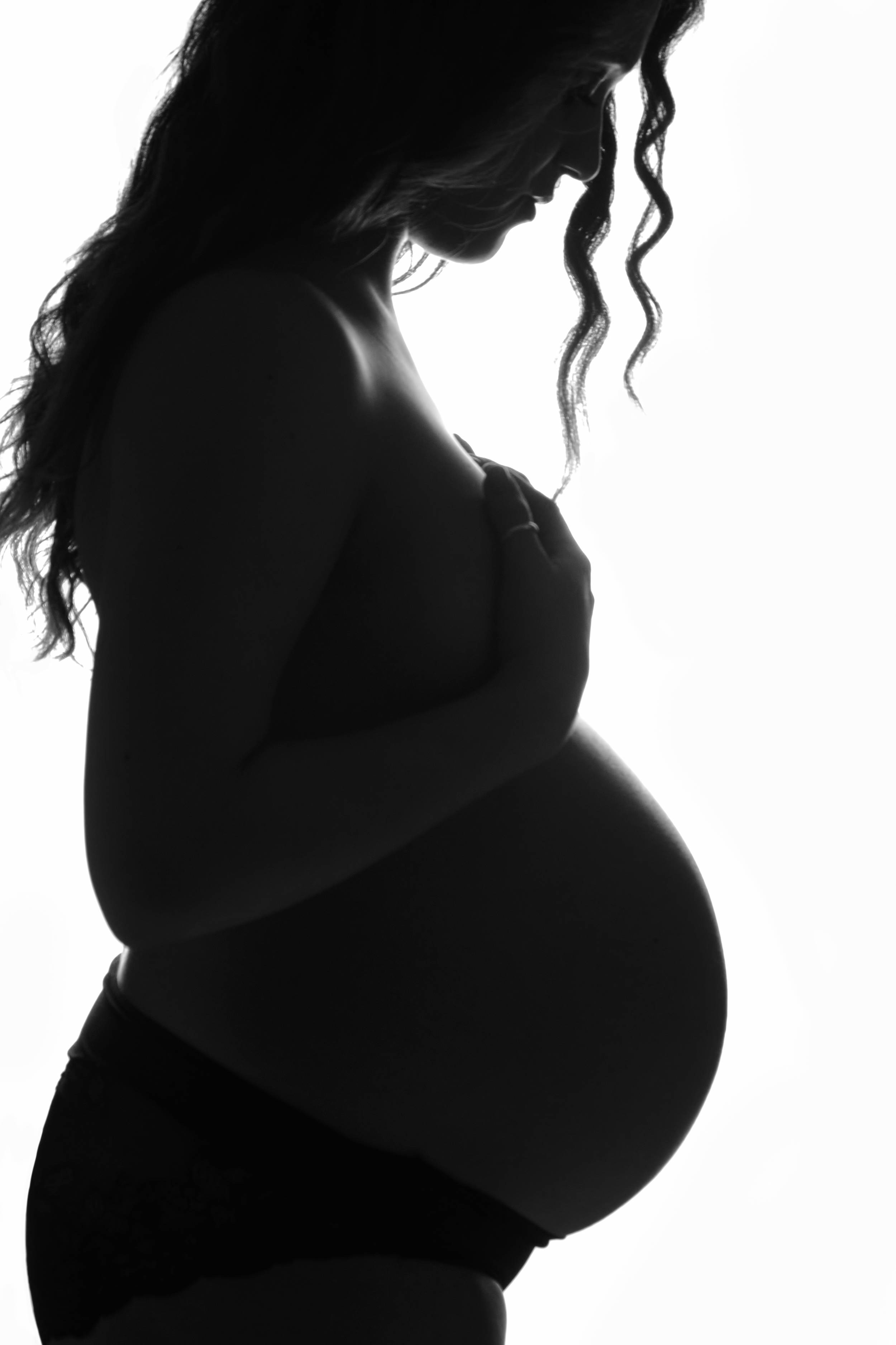 pregnancy-of-young-woman-profile-in-backlight-2022-10-31-10-10-17-utc_bOgXZ_Q2L.jpg
